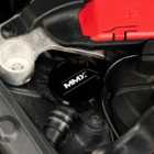 Official MMX billet washer fluid filler cap installed in a BMW engine bay