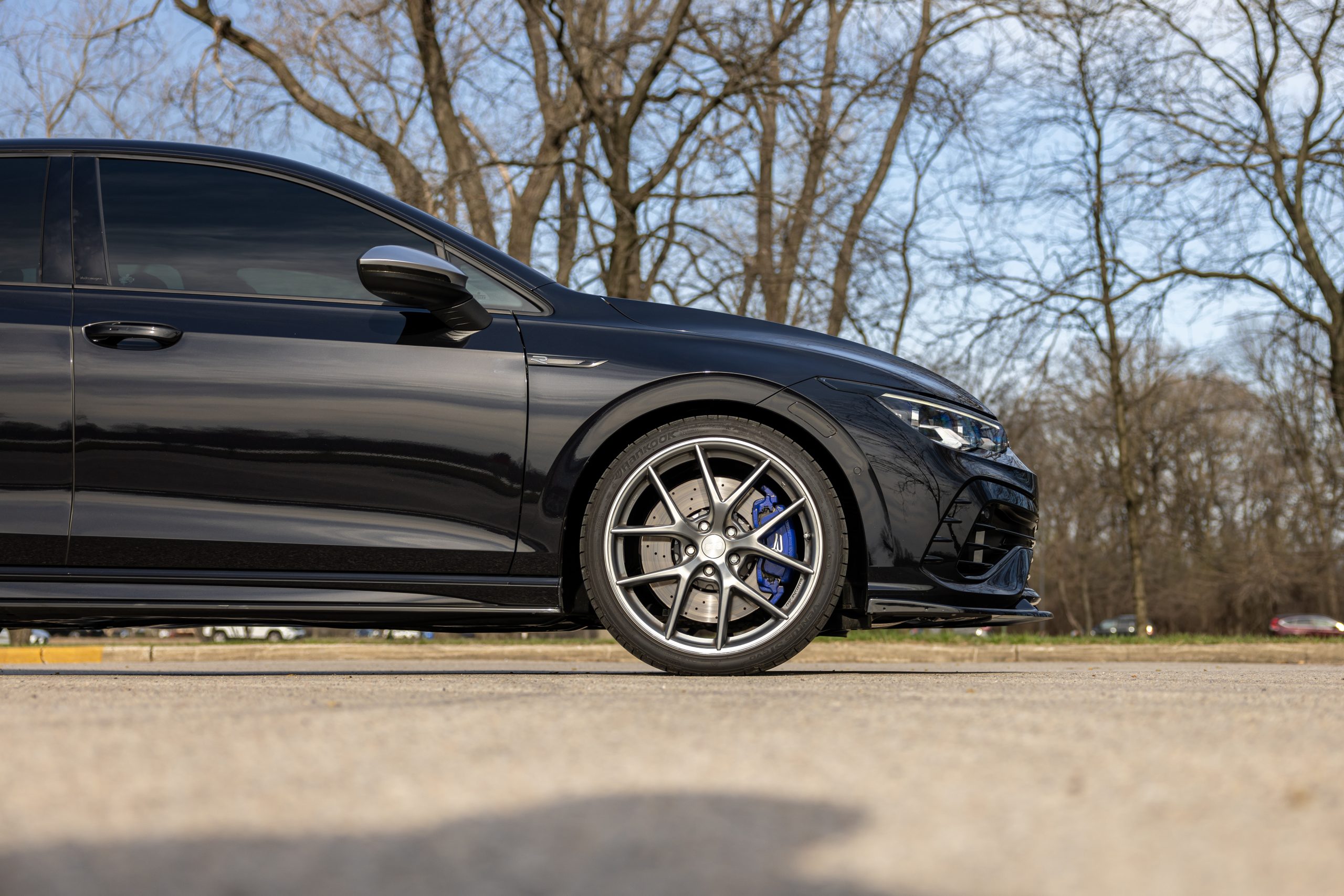 Blue Volkswagen Golf R MK8 with RacingLine Performance upgrades, forged wheels, Bilstein suspension, and H&R lowering springs at EA Performance Australia.